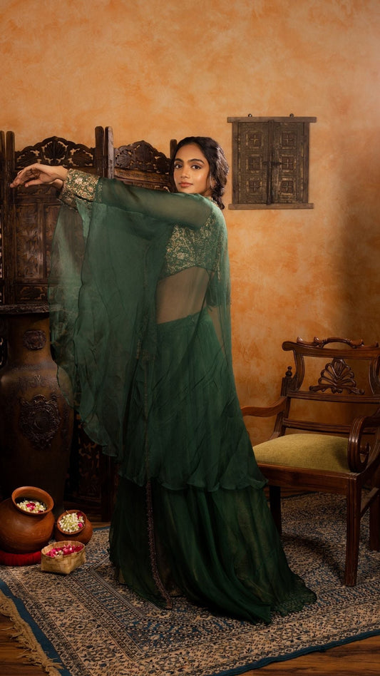 Long-Sleeved Blouse with Sheer Cape paired with a Skirt