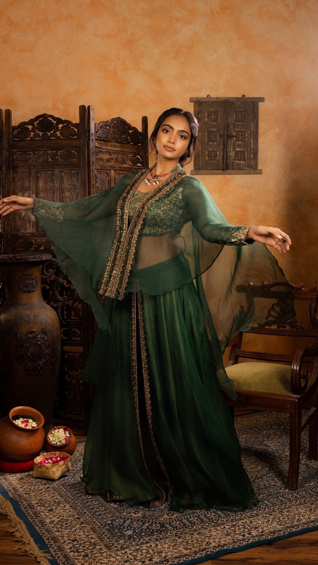 Long-Sleeved Blouse with Sheer Cape paired with a Skirt